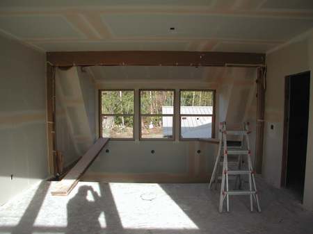 A room being remodeled with the walls up.